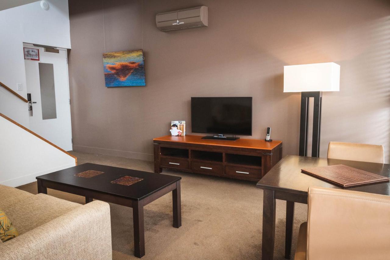 The Henry Jones Art Hotel Hobart Eksteriør bilde A living room in a typical apartment at the Village at Grand Traverse Commons